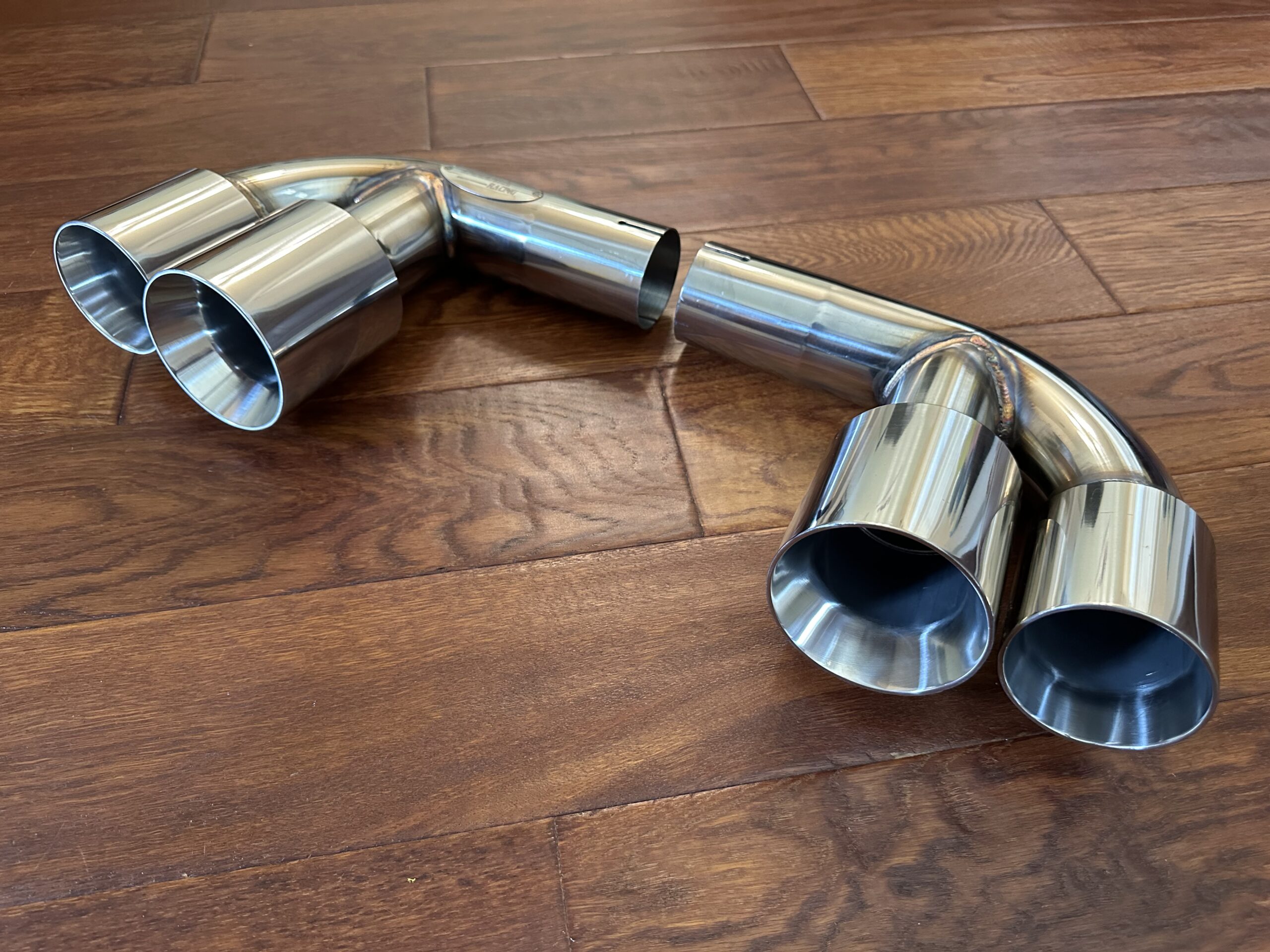 Polished stainless steel quad exhaust tips